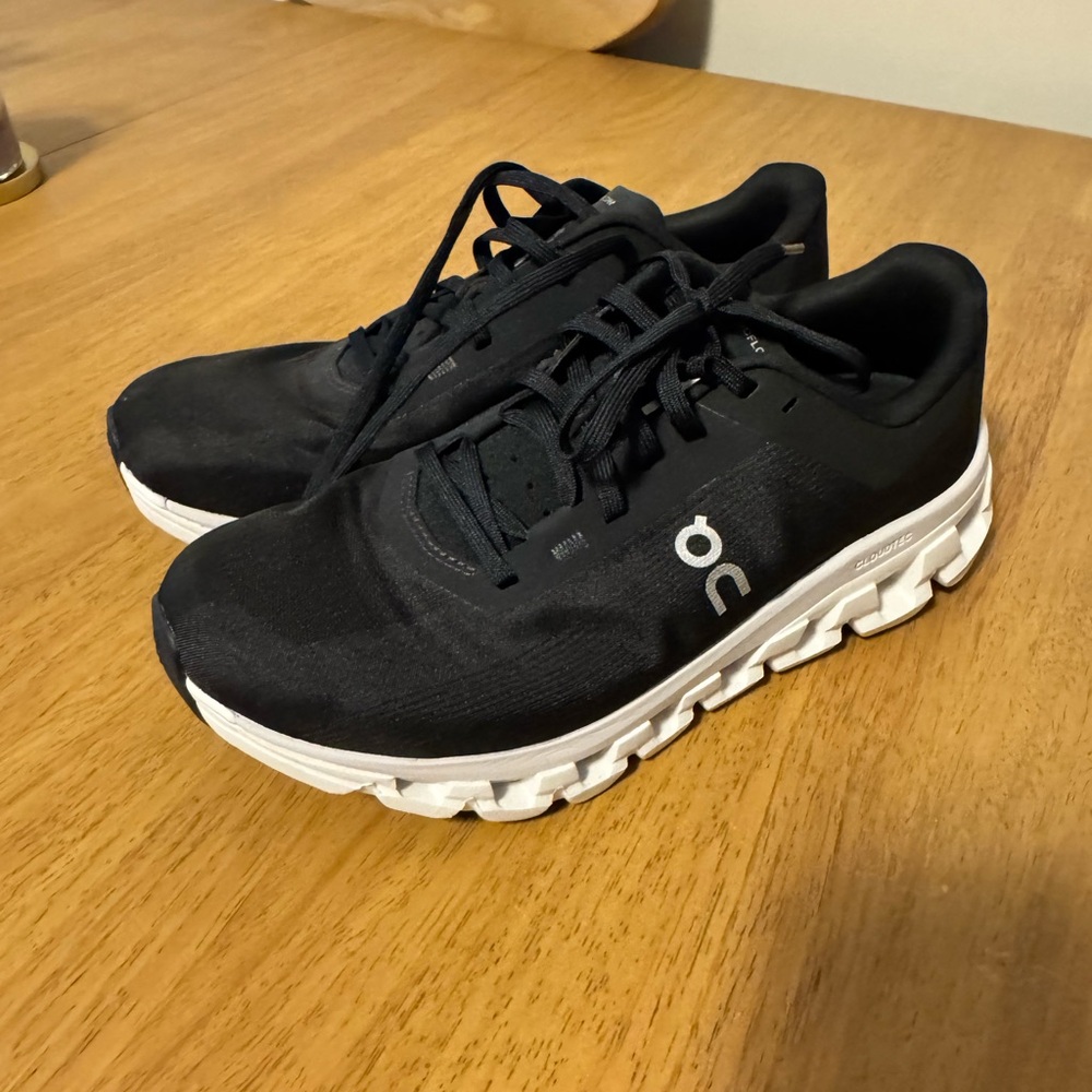 On Running Black Athletic Shoes with White Soles